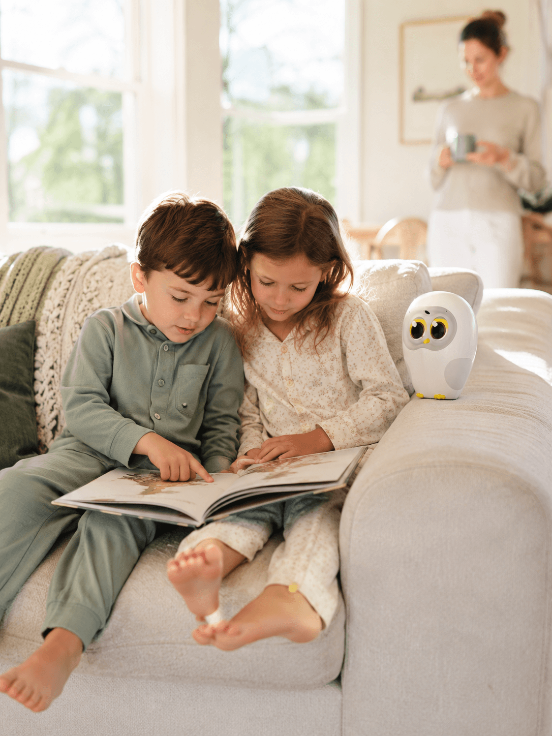 Kids reading on the living-room couch before school